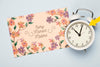 Top View Of Floral Card With Clock Psd