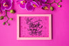 Top View Of Frame And Flowers On Pink Background Psd