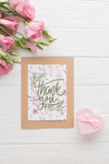 Top View Of Frame Mock-Up And Flowers On Wooden Background Psd