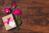 Top View Of Gift With Roses And Copy Space Psd