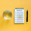 Top View Of Glass Of Water With Notebook And Pen Psd