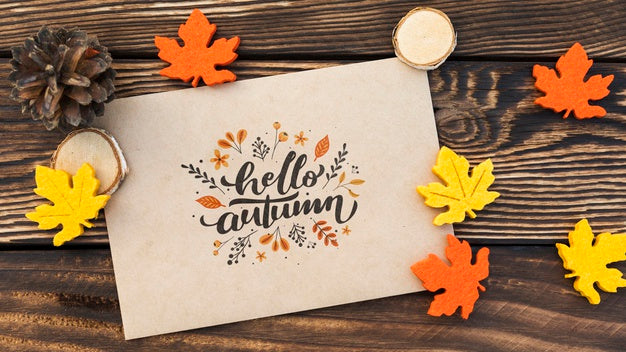 Top View Of Hello Autumn Paper On Wooden Table Psd