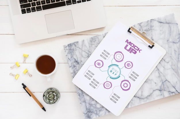 Top View Of Laptop With Notepad On Desk Psd