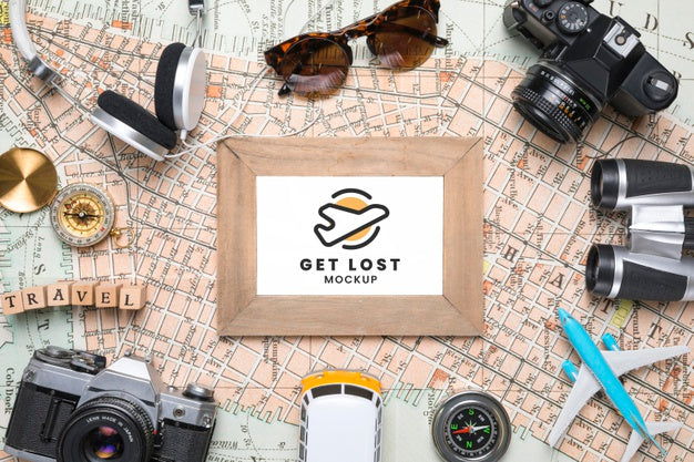 Top View Of Map With Frame And Other Traveling Essentials Psd