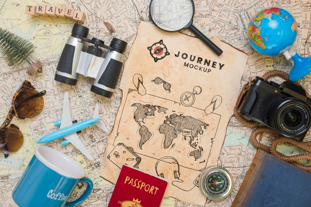 Top View Of Map With Magnifying Glass And Camera For Traveling Psd