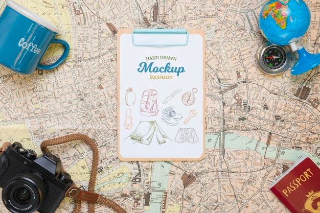 Top View Of Map With Mock-Up Traveling Essentials Psd