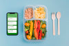 Top View Of Meal With Vegetables And Smartphone Psd