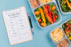 Top View Of Meals With Notepad Psd