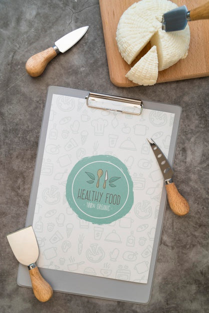 Top View Of Menu With Cheese And Utensils Psd