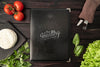Top View Of Menu With Tomatoes And Cutlery Psd