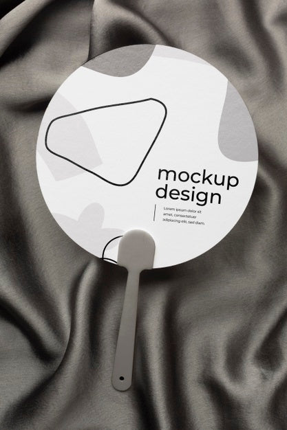 Top View Of Mock-Up Hand Fan On Black Textile Psd