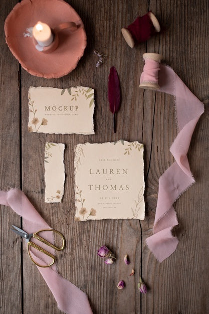 Top View Of Mock-Up Rustic Paper Wedding Invitation With Leaves And Flowers Psd