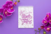 Top View Of Notebook And Flowers On Purple Background Psd