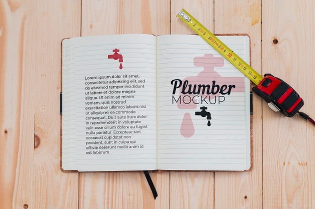 Top View Of Notebook And Measuring Tape For Plumber Psd