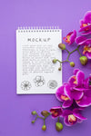 Top View Of Notebook Mock-Up With Orchid Psd