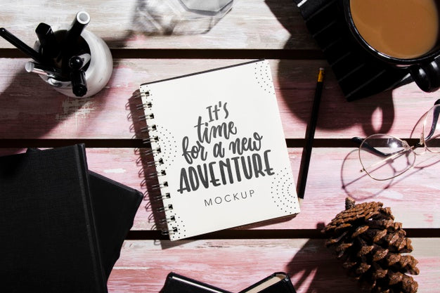 Top View Of Notebook On Desk With Pine Cone And Coffee Psd
