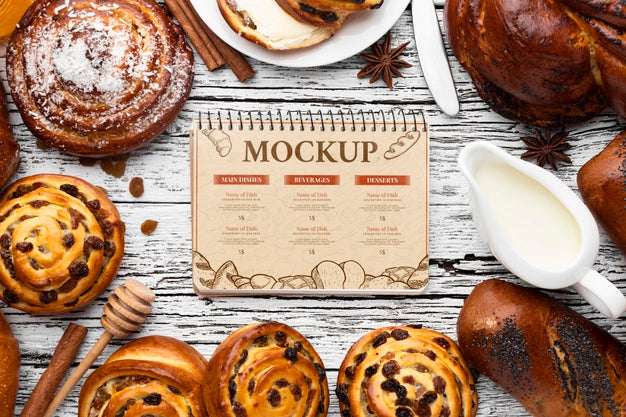 Top View Of Notebook With Assortment Of Pastries Psd