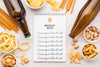 Top View Of Notebook With Assortment Of Snacks And Beer Bottles Psd