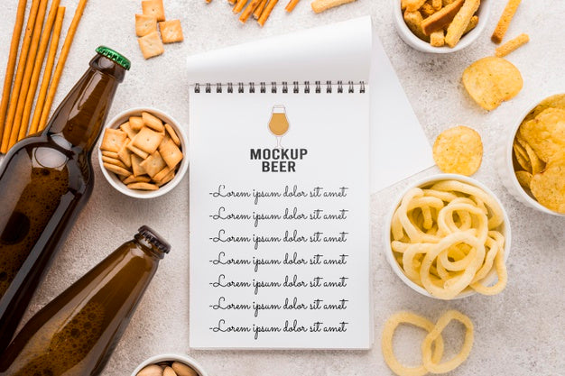 Top View Of Notebook With Beer Bottles And Assortment Of Snacks Psd