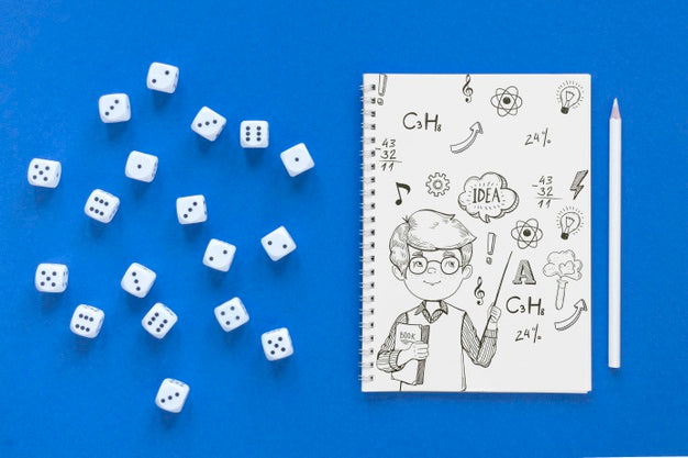 Top View Of Notebook With Dice And Pencil Psd