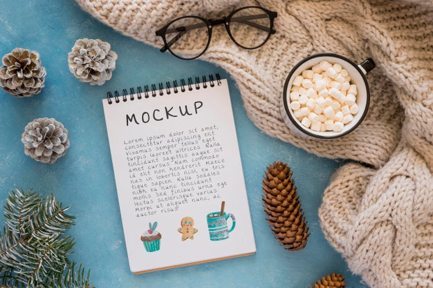 Top View Of Notebook With Marshmallows And Glasses Psd