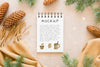 Top View Of Notebook With Pine Cones And Scarf Psd