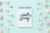 Top View Of Notebook With Spring Roses Psd