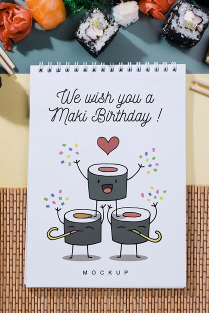 Top View Of Notebook With Sushi Psd