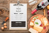 Top View Of Notepad With Assortment Of Locally Grown Cheese And Wine Psd
