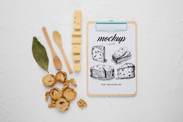 Top View Of Notepad With Cheese And Spoons Psd