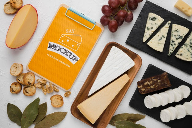 Top View Of Notepad With Cheese And Walnuts Psd
