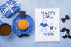 Top View Of Notepad With Gift And Cupcake For Fathers Day Psd