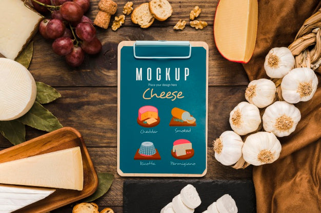 Top View Of Notepad With Grapes And Cheese Psd