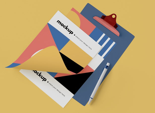 Top View Of Notepad With Paper And Geometric Shapes Psd