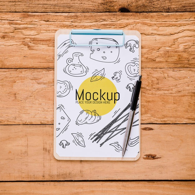 Top View Of Notepad With Pen And Cheese Design Psd