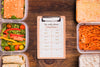Top View Of Notepad With Planned Meals Psd
