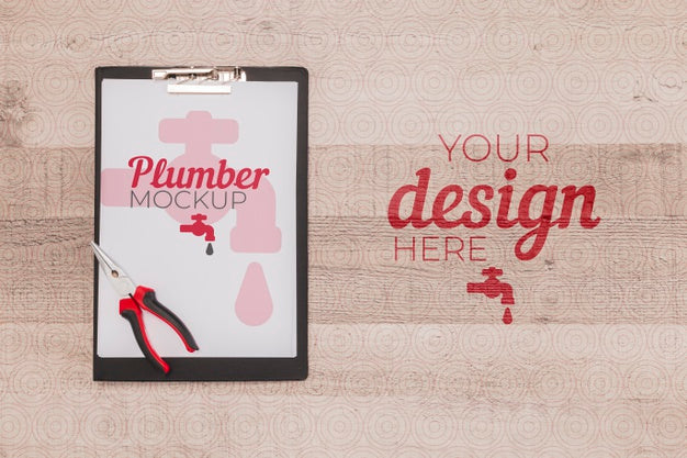 Top View Of Notepad With Plumber Tools Psd