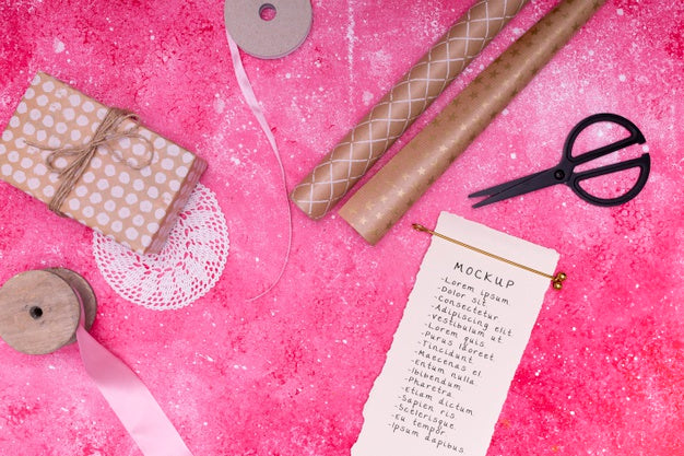 Top View Of Notepad With Present And Ribbon Psd