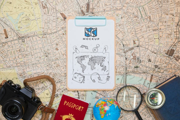 Top View Of Notepad With Traveling Essentials And Camera Psd