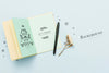 Top View Of Open Book With Pen And Flowers Psd