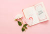 Top View Of Open Book With Rose And Heart Psd