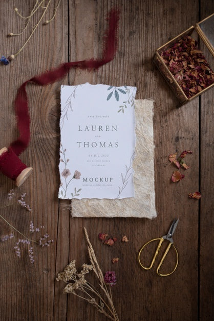 Top View Of Paper Mock-Up Rustic Wedding Invitation With Leaves And Flowers Psd