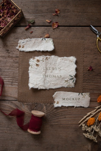 Top View Of Paper Mock-Up Rustic Wedding Invitation With Leaves And Flowers Psd