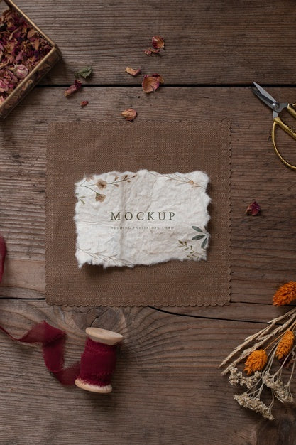 Top View Of Paper Mock-Up Rustic Wedding Invitation With Leaves And Flowers Psd