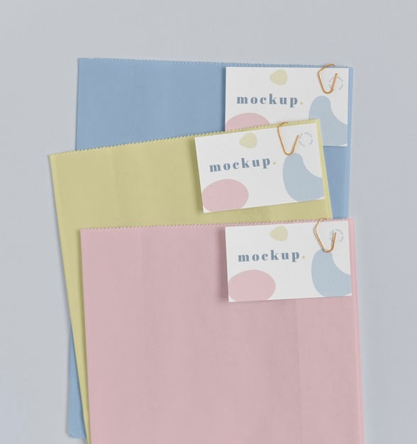 Top View Of Paper Shopping Bag Mock-Up With Paper Tag Psd