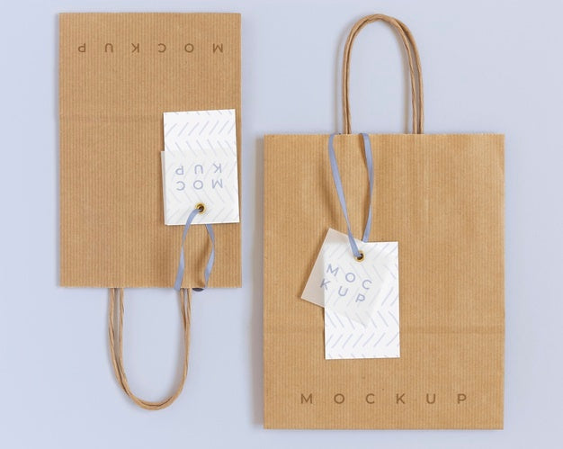 Top View Of Paper Shopping Bag Mock-Up With Paper Tag Psd