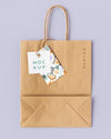 Top View Of Paper Shopping Bag Mock-Up With Paper Tag Psd