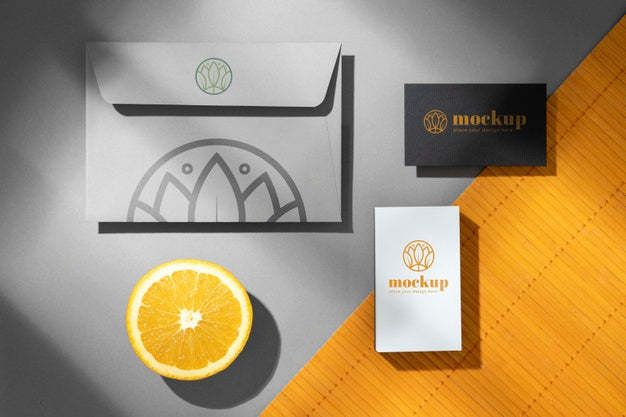 Top View Of Paper Stationery With Citrus Fruit Psd