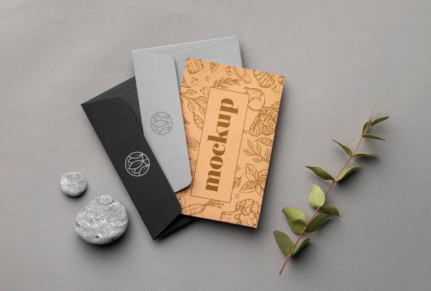 Top View Of Paper Stationery With Leaves And Rocks Psd