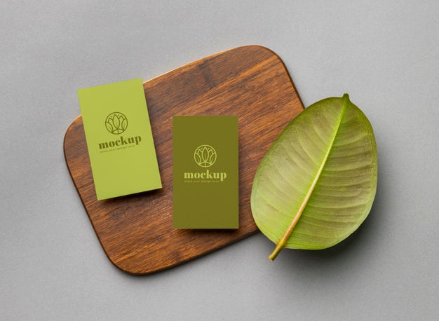 Top View Of Paper Stationery With Leaves Psd